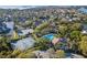 Residential community featuring a community pool, tennis courts and waterfront views at 1020 Lake Avoca Dr, Tarpon Springs, FL 34689