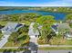Beautiful waterfront home with mature trees, lush landscaping, and stunning views of the bay at 1020 Lake Avoca Dr, Tarpon Springs, FL 34689