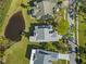 Residential neighborhood featuring mature trees and manicured lawns at 1020 Lake Avoca Dr, Tarpon Springs, FL 34689