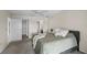 Bedroom offering a comfortable bed, large closet and ensuite bathroom at 1020 Lake Avoca Dr, Tarpon Springs, FL 34689