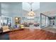 Inviting common area with wood flooring, comfortable seating and large windows offering plenty of natural light at 1020 Lake Avoca Dr, Tarpon Springs, FL 34689