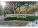 Fred H. Howard Park entrance sign featuring stone construction and lush greenery, a welcoming gateway to recreation at 1020 Lake Avoca Dr, Tarpon Springs, FL 34689