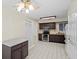 Spacious eat-in kitchen with stainless appliances, dark cabinetry and classic tile flooring at 1020 Lake Avoca Dr, Tarpon Springs, FL 34689