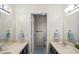 Main bathroom features dual sinks, large mirrors, and a separate toilet and shower area at 1020 Lake Avoca Dr, Tarpon Springs, FL 34689