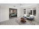 Cozy living room with a connecting bedroom and sunroom with lake views at 1020 Lake Avoca Dr, Tarpon Springs, FL 34689
