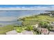 Stunning aerial view showcasing the property's waterfront location and lush surroundings at 104 Westbrook Ct, Safety Harbor, FL 34695