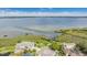 Aerial view of home on the bay with circle drive on a beautifully landscaped lot at 104 Westbrook Ct, Safety Harbor, FL 34695