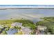 Aerial view of waterfront properties on a clear day with blue skies and water at 104 Westbrook Ct, Safety Harbor, FL 34695