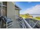 Cozy balcony seating area with marsh and water views at 104 Westbrook Ct, Safety Harbor, FL 34695