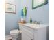 Powder room with a decorative mirror and framed picture at 104 Westbrook Ct, Safety Harbor, FL 34695
