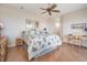 Spacious bedroom features hardwood floors, ceiling fan, and desk with chair at 104 Westbrook Ct, Safety Harbor, FL 34695