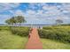 Private dock and walkway with stunning waterfront views perfect for boaters and nature lovers at 104 Westbrook Ct, Safety Harbor, FL 34695