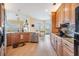 Well-lit kitchen with stainless appliances, hardwood floors, and breakfast nook at 104 Westbrook Ct, Safety Harbor, FL 34695