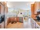 Bright kitchen with stainless appliances, hardwood floors, and breakfast nook at 104 Westbrook Ct, Safety Harbor, FL 34695