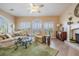 Inviting living room with water view, neutral decor, a fireplace, and hardwood floors at 104 Westbrook Ct, Safety Harbor, FL 34695