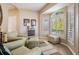 Bright sitting area with hardwood floors, neutral walls, and large windows overlooking the yard at 104 Westbrook Ct, Safety Harbor, FL 34695