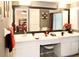 Stylish bathroom with a double-sink vanity, large mirror, and a shower, offering modern comfort at 10440 Laval St, Spring Hill, FL 34608