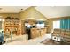 Open concept living space featuring tile flooring, eat-in bar, living room and dining area at 10440 Laval St, Spring Hill, FL 34608