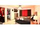 Cozy main bedroom with an ensuite bathroom, a ceiling fan, and unique decor for comfort at 10440 Laval St, Spring Hill, FL 34608