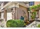 Manicured yard with green shrubbery, foliage, and brick pillar at the front entrance at 11190 Windsor Place Cir, Tampa, FL 33626