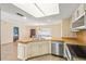 Well-lit kitchen area featuring a breakfast bar with views into the dining area at 11207 Allwood St, Spring Hill, FL 34609