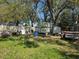 Spacious backyard, with trailers, containers, and project materials at 11326 Brightridge Dr, Seffner, FL 33584