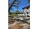 Home exterior with spacious yard and partial view of white fencing at 11326 Brightridge Dr, Seffner, FL 33584