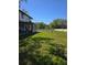 Expansive backyard featuring green grass and partial fencing at 11326 Brightridge Dr, Seffner, FL 33584