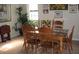 Cozy dining room with wooden table and chairs, plants, and natural light at 11326 Brightridge Dr, Seffner, FL 33584