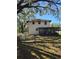 Rear exterior view showing a screened porch and sprawling yard at 11326 Brightridge Dr, Seffner, FL 33584