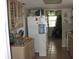 Kitchen view featuring a refrigerator, cabinets, countertop, and a Christmas tree in the background at 11326 Brightridge Dr, Seffner, FL 33584