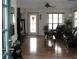 Welcoming living room with hardwood floors, TV, comfortable seating, and natural light at 11326 Brightridge Dr, Seffner, FL 33584