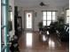 Welcoming living room with hardwood floors, TV, comfortable seating, and natural light at 11326 Brightridge Dr, Seffner, FL 33584