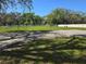 Spacious grass yard featuring a concrete pad and partial fencing at 11326 Brightridge Dr, Seffner, FL 33584