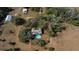 Aerial view of home featuring a pool and surrounding wooded area at 11327 Carter Grove Ln, Thonotosassa, FL 33592