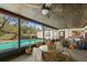 Outdoor dining area with a patio and a view of the backyard with a pool at 11327 Carter Grove Ln, Thonotosassa, FL 33592
