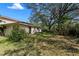 Backyard showing the home's exterior and green spaces for outdoor activities at 11327 Carter Grove Ln, Thonotosassa, FL 33592