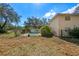 Fenced pool with lush greenery and backyard view, creating a private oasis at 11327 Carter Grove Ln, Thonotosassa, FL 33592