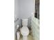 Bathroom with toilet and glass block partition at 11327 Carter Grove Ln, Thonotosassa, FL 33592