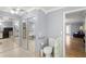 Accessible bathroom with toilet, mirrored closet doors, and tile floors at 11327 Carter Grove Ln, Thonotosassa, FL 33592