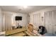 Bright bedroom with closet space and a modern television at 11327 Carter Grove Ln, Thonotosassa, FL 33592