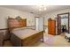 Comfortable bedroom featuring classic furniture, neutral tones, and vintage-inspired decor at 11327 Carter Grove Ln, Thonotosassa, FL 33592
