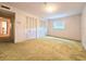 Cozy bedroom featuring neutral walls and carpeting, closet, and natural light at 11327 Carter Grove Ln, Thonotosassa, FL 33592