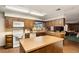 Spacious kitchen featuring a center island and white appliances at 11327 Carter Grove Ln, Thonotosassa, FL 33592