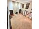 A well lit living room that features a fireplace, bookshelf, and three windows to illuminate the space at 11327 Carter Grove Ln, Thonotosassa, FL 33592