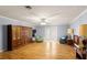 Living room featuring laminate floors, light walls, access to backyard, and recessed lighting at 11327 Carter Grove Ln, Thonotosassa, FL 33592