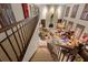 View from the staircase of the living room with stone fireplace at 11327 Carter Grove Ln, Thonotosassa, FL 33592
