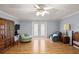 Living room featuring laminate floors, light walls, access to backyard, and recessed lighting at 11327 Carter Grove Ln, Thonotosassa, FL 33592