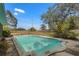 A beautiful in-ground pool with surrounding fence and views of the grassy backyard at 11327 Carter Grove Ln, Thonotosassa, FL 33592