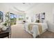 Bright main bedroom featuring a trey ceiling, large windows and serene backyard views at 12513 30Th Street E Cir, Parrish, FL 34219